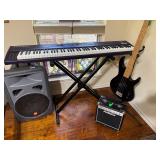 JBL Eon Power speaker, Kurzweil keyboard SP88, Ibanez 4 string electric guitar TRB50, FirstAct Amplifier