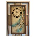 MCM wall clock with distinctive wooden frame & Asian-inspired aesthetic.