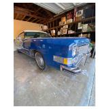 1973 Cadillac Eldorado convertible with white leather interior.