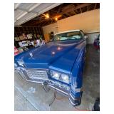 1973 Cadillac Eldorado convertible with white leather interior.