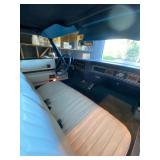 1973 Cadillac Eldorado convertible with white leather interior.