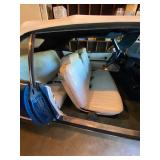 1973 Cadillac Eldorado convertible with white leather interior.