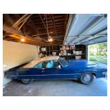 1973 Cadillac Eldorado convertible with white leather interior.