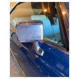 1973 Cadillac Eldorado convertible with white leather interior.