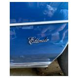 1973 Cadillac Eldorado convertible with white leather interior.