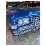 1973 Cadillac Eldorado convertible with white leather interior.
