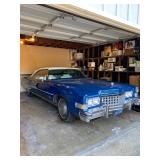 1973 Cadillac Eldorado convertible with white leather interior.