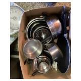 lots of baking pans, aluminum bowl sets, etc