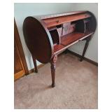 Barrel desk with pull out drawer on side. 