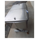 Stainless steel rolling patio cooler double fold back lids note, has some bumps and bruises but stil