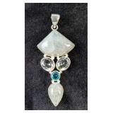 Sterling Silver, Moonstone Cabochon, And Light Blue Topaz Gemstone Pendant In Floating Display Case,