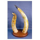 Carved Horns With Eagle Head Tips And Engraved Feather Design, Mounted On Wood Carved Horns With Eagle Head Tips And Engraved Feather Design, Mounted On Wood