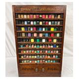 Brainerd & Armstrong’s Oak Spool Cabinet with Glass Front, 17 x 27 1/2 Inches