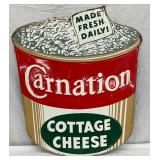 24″ x 28″ Early Embossed Carnation Cottage Cheese Die-Cut Tin Advertising Sign