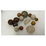 Early Glass and Clay Marbles in Varying Colors and Sizes