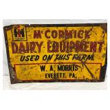 Embossed Metal McCormick Dairy Equipment Advertising Sign, 23in x 14 1/2in