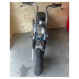 chrome fenders, black vinyl saddle, and off-road tires