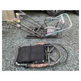 Two Hunting Tree Stands with Metal Frames and Camouflage Materials