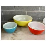 Three Colorful Nesting Mixing Bowls in Red, Yellow, and Blue