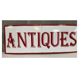 Porcelain Advertising Sign with ‘Antiques’ Text, 43×17 Inches