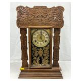 Carved Wood Case Mantel Clock With Brass Dial and Reverse-Painted Glass Carved Wood Case Mantel Clock With Brass Dial and Reverse-Painted Glass