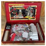 Red Metal Erector Set Case with Assorted Parts and Accessories
