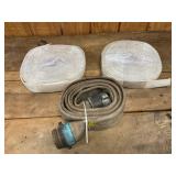 Three Fire or Water Discharge Hoses in Various Sizes