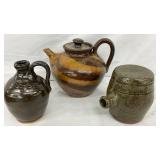 Three Stoneware Pottery Pieces: Two Jugs and a Lidded Teapot