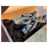 Engine components including various rubber hoses, 
