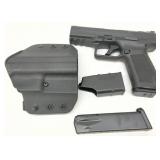 two magazines, a polymer holster, a magazine loader two magazines, a polymer holster, a magazine loader