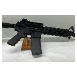 a 30-round polymer magazine, and a forward assist a 30-round polymer magazine, and a forward assist
