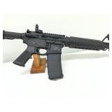 railing, an adjustable stock, and a removable 30-round magazine railing, an adjustable stock, and a removable 30-round magazine
