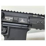 SureFire light mounted on the handguard SureFire light mounted on the handguard