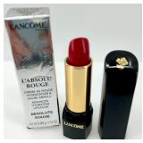 Collection of Luxury Makeup Including Lipsticks, Mascara, and Clinique Moisture Surge