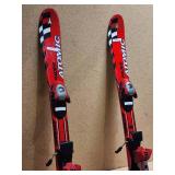 Pair of Youth Atomic Racing Down Hill Ski