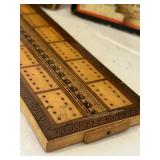 K - Vintage Game and Book Collection Including Monopoly, Cribbage Board, Compass, and Poor Richard