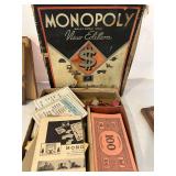 K - Vintage Game and Book Collection Including Monopoly, Cribbage Board, Compass, and Poor Richard