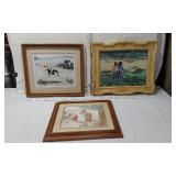 Three Framed Art Prints with Charming Scenes - The first print depicts a child with a calf in a pastoral setting, the second shows two children in a field, and the third features a child with toys