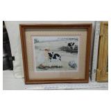 Three Framed Art Prints with Charming Scenes - The first print depicts a child with a calf in a pastoral setting, the second shows two children in a field, and the third features a child with toys