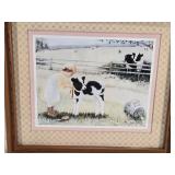 Three Framed Art Prints with Charming Scenes - The first print depicts a child with a calf in a pastoral setting, the second shows two children in a field, and the third features a child with toys