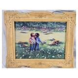 Three Framed Art Prints with Charming Scenes - The first print depicts a child with a calf in a pastoral setting, the second shows two children in a field, and the third features a child with toys