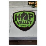 Beer Advertising Signs including Hop Valley Brewing Co., Two Hearted Ale, Truly Fruit Punch, and JÃ¤germeister