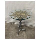 Glass Top Accent Table with Ornate Brass Medallion and Metal Base