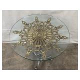 Glass Top Accent Table with Ornate Brass Medallion and Metal Base