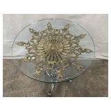 Glass Top Accent Table with Ornate Brass Medallion and Metal Base