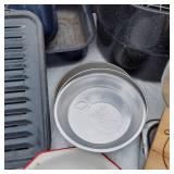 Kitchenware Collection including Enamelware Pots, Pans, and Cutting Board