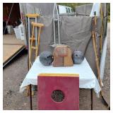 Vintage sports equipment lot including Brunswick Black Beauty and AXIS bowling balls, Pogo stick, hockey sticks, and additional items.