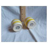 Salt and pepper shakers with yellow and white stripes