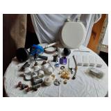 Assorted Plumbing Supplies and Tools including Drill Powered Drain Auger, Toilet Seat, and Various Fittings