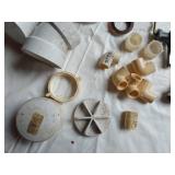 Assorted Plumbing Supplies and Tools including Drill Powered Drain Auger, Toilet Seat, and Various Fittings